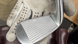 Iron fitting, close on the club and glove
