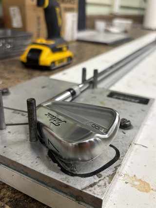Iron head being fit on the workbench