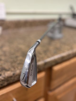 Iron head close-up on the fitting counter